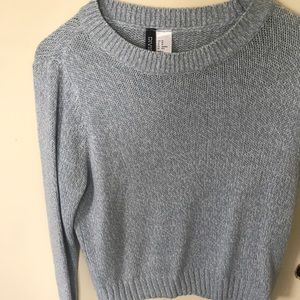 Light weight knitted sweater. Light blue